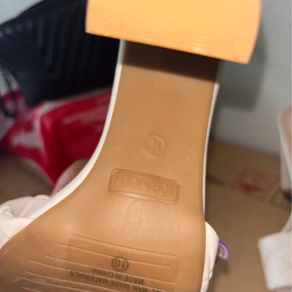 This is a pair of white square-toe flat sandals from the brand "TOP MODA". - Picture 4 of 5